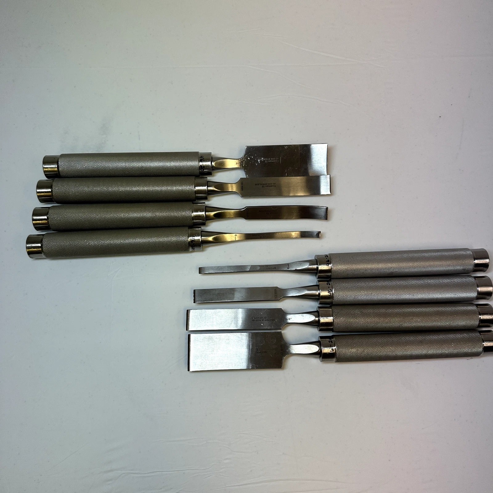Set of 8 Codman OptiLength 11″ Straight & Curved Osteotomes w/ Case Orthopedics