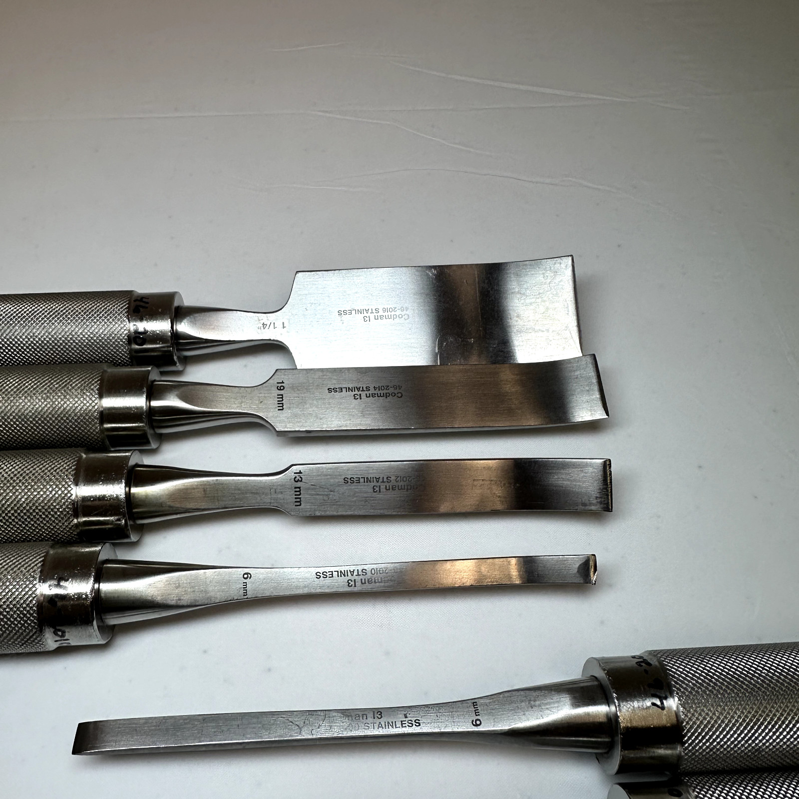 Set of 8 Codman OptiLength 11″ Straight & Curved Osteotomes w/ Case Orthopedics