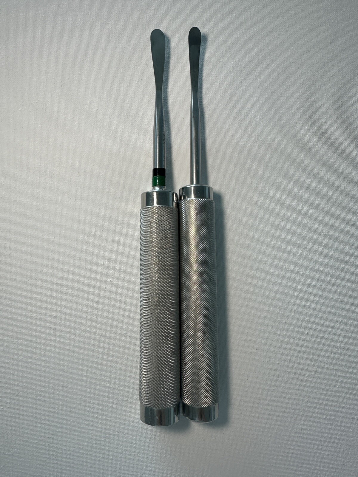 Aesculap pair of small cobbs FK146R, slight curve, and very curved.