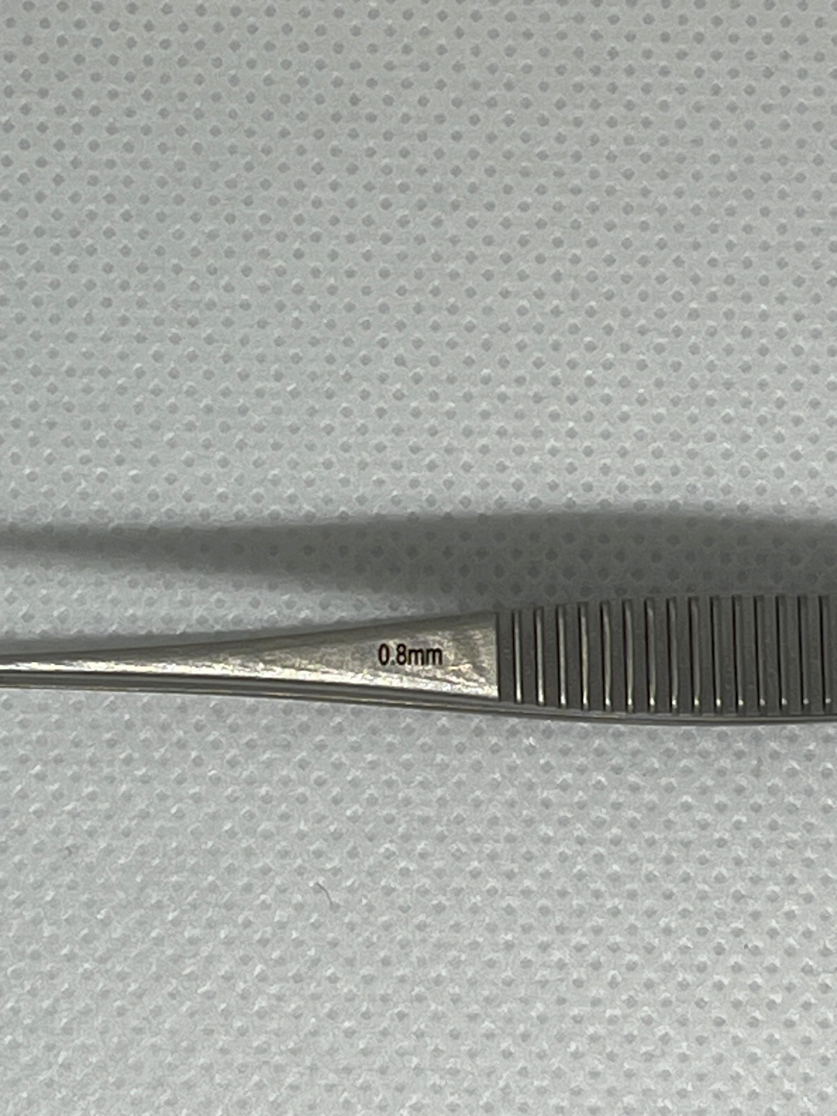 FST Graefe Serrated Forceps, 3.9″ Length, 1/32″ Tip, Ridged Grip, Excellent