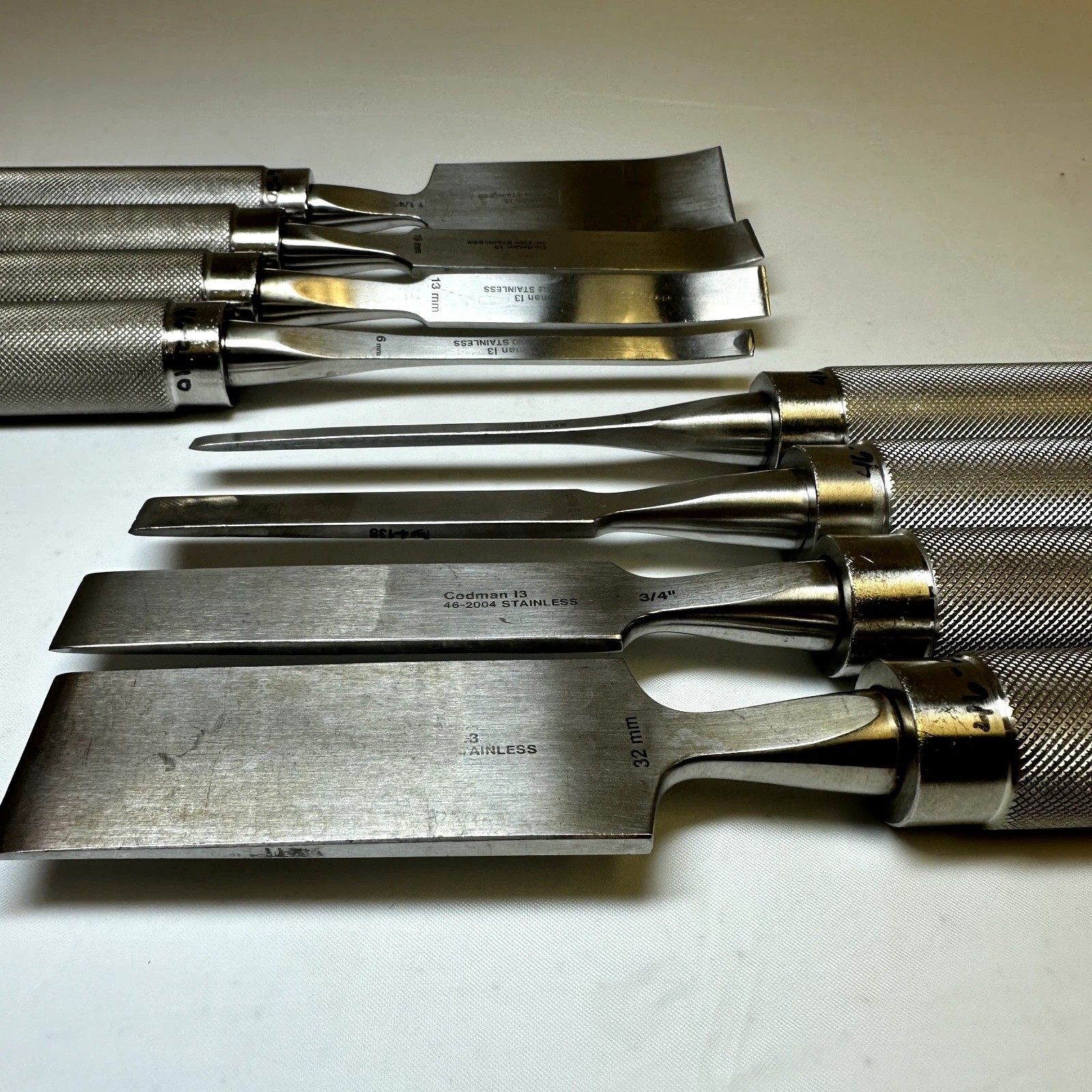 Set of 8 Codman OptiLength 11″ Straight & Curved Osteotomes w/ Case Orthopedics