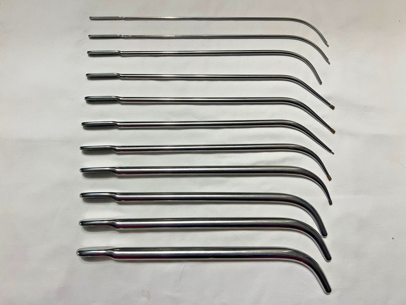 Set Of 11 V. Mueller Van Buren & Lefort Urethral Sound Dilators Curved 10-5/8″ L