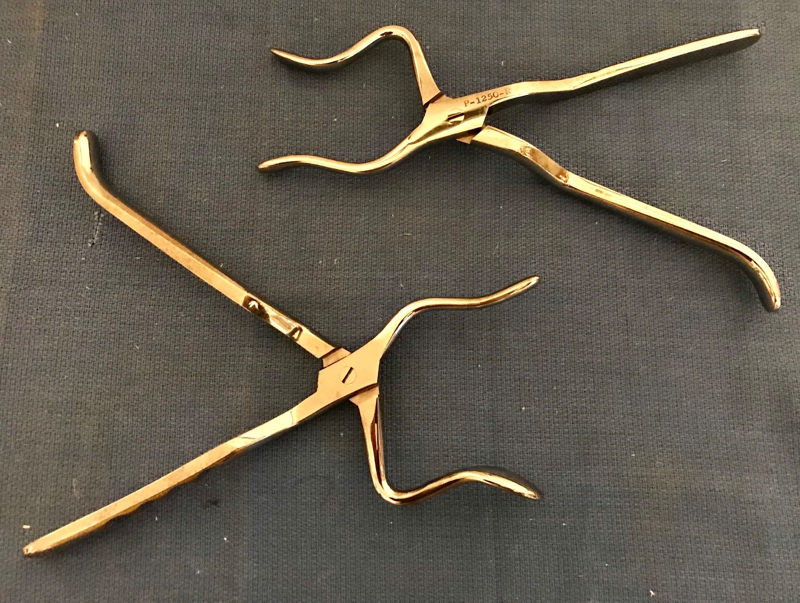 Padgett P-1250-R and P-1250-L Rowe maxillary disimpaction forceps. GC, guarantee